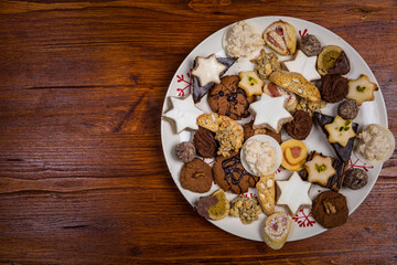 Assorted Christmas cookies on wooden table