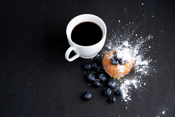 Blueberry antioxidant organic superfood and sweet muffin with cup of coffee