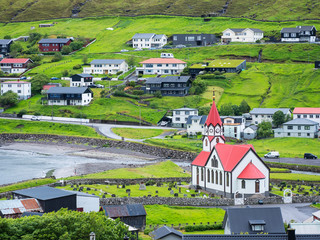 view to little city and red church on the coast on Faroe islands Big size