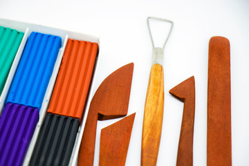 Professional set of tools for modeling clay and clay on a white background