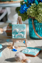 Festive table with desserts and a drink in the cafe. Decor holiday design