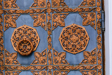 Closeup of the old door with fancy pattern