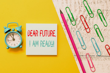 Handwriting text Dear Future I Am Ready. Conceptual photo Confident to move ahead or to face the future Notepad marker pen colored paper sheet clips alarm clock wooden background