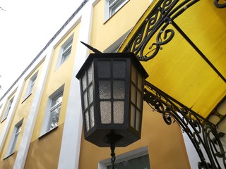 Fototapeta na wymiar lamp hanging on building porch
