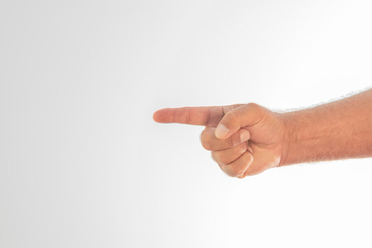 Detail of a man's hand pointing with his finger on a white background. Space to write.