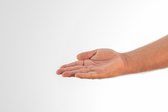 A man's hand stretched out on a white background. Space to write.