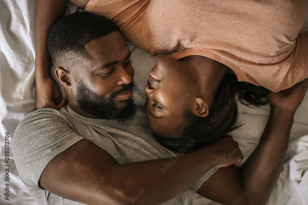 Canvas Prints loving african american couple looking at each other in bed