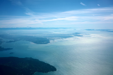  Vancouver,Canada-August 28, 2019: Aerial view of Strait of Georgia, Burrard Inlet and Vancouver in the morning 