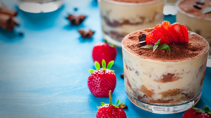 Strawberry dessert tiramisu in a glass whith mint