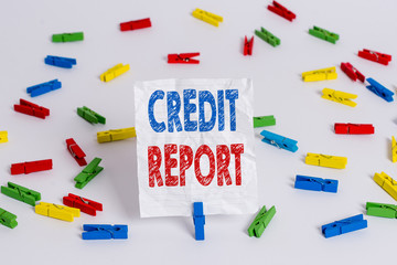 Text sign showing Credit Report. Business photo showcasing Borrowing Rap Sheet Bill and Dues Payment Score Debt History Colored clothespin papers empty reminder white floor background office