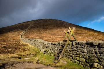 Stile over the Mourne Wall at Hare's Gap, Mourne Mountains, County Down, Northern Ireland. © Sebastian