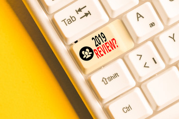 Word writing text 2019 Review Question. Business photo showcasing remembering past year events main actions or good shows White pc keyboard with empty note paper above white background key copy space