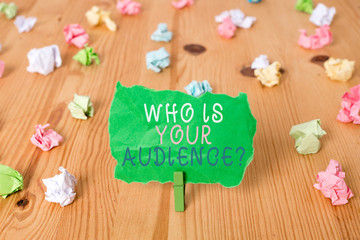 Word writing text Who Is Your Audience Question. Business photo showcasing who is watching or listening to it Colored crumpled papers empty reminder wooden floor background clothespin