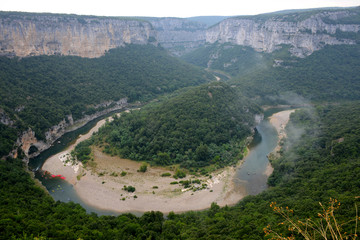 Fototapeta na wymiar aerial view of Ardèche river bend with kayaks and canoes