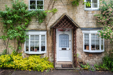 WINCHCOMBE, ENGLAND -MAY, 25 2018: Cottage in the ancient Anglo Saxon town of Winchcombe, Cotswolds, Gloucestershire, England