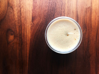 cup of coffee on wooden table