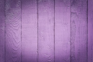 Wooden background texture. Creatively painted intense violet boards.