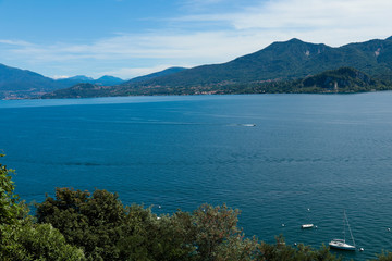 Lago maggiore ore lake maggiore beautiful panorama sunny day with blue sky and fluffy clouds