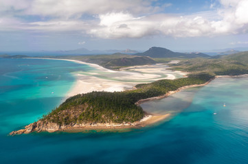 Aerial shot of Hill Inlet over Whitsunday Island - swirling white sands, sail boats and blue green water