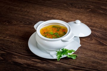 Delicious diet vegetarian soup on a dark table