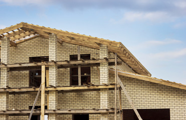 Fragment of a brick-built house with a wooden roof