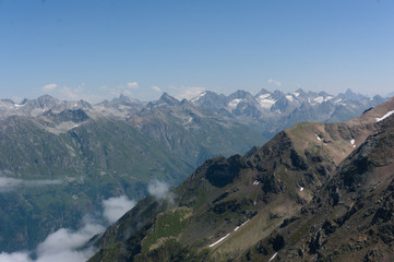 Fototapeta na wymiar Panorama of the Caucasian ridge and Elbrus viewed from a peak near dombay, 2019