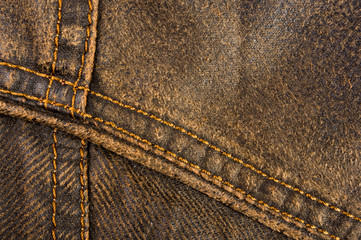 clothing items stonewashed cotton fabric texture with seams, clasps, buttons and rivets, macro