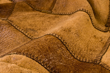 Old vintage genuine soft brown leather texture background, top layer with pores and scratches,...