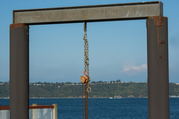 Pulley hanging from structure on dock