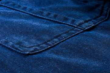 Naklejka premium clothing items stonewashed cotton fabric texture with seams, clasps, buttons and rivets, macro