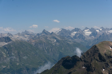 Panorama of the Caucasian ridge and Elbrus viewed from a peak near dombay, 2019
