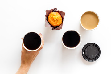 Coffee to-go, muffin on white background top view. Translation of the Russian text on the lid is...