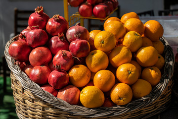 Oranges and Pomegranates in a basket