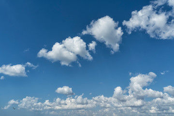 White summer clouds in the blue sky