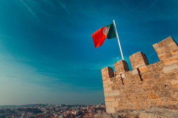 Portugal flag on top of a medieval tower