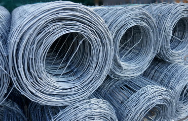 Wire mesh fence, rolled up. Close up, texture, background,