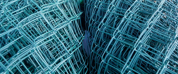 Wire mesh fence, rolled up. Close up, texture, background,