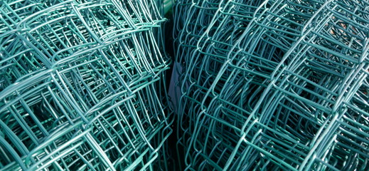 Wire mesh fence, rolled up. Close up, texture, background,
