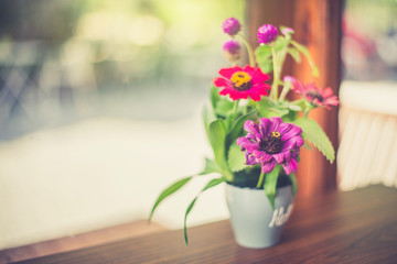 Flower vases in the cafe with warm colors.
