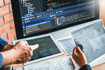 Developing programmer Team Development Website design and coding technologies working in software company office