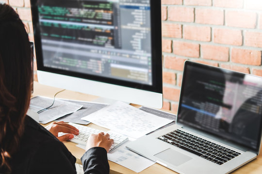 Developing programmer Development Website design and coding technologies working in software company office stock