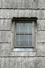 Wooden window on an ancient wooden chip windmill in Lazdininkai