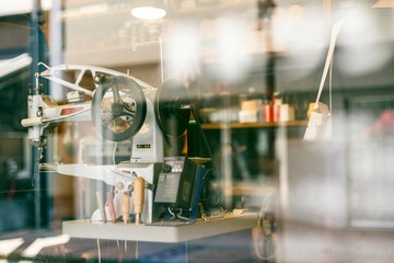 shoe repair craftsman in his studio
