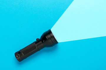 Flashlight or torch lighting up background - minimal concept for internet search or direction finding - obrazy, fototapety, plakaty