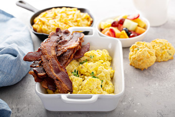 Full breakfast with scrambled eggs, bacon and potatoes