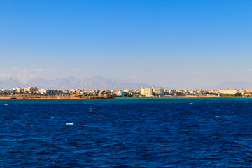 Beautiful view of the coastline with houses and hotels in Hurghada, Egypt. View from Red sea