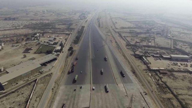 A top view of a motorway toll plaza of the city, Heavy vehicles and others moving.