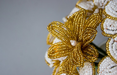 Golden flower macro shot. Flowers from the beads.