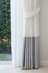 Close up of white modern curtain detail of Holder, interior detail.
