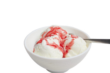 balls of white vanilla ice cream with red berry syrup in a white bowl on a white background. A spoon lies in a bowl
